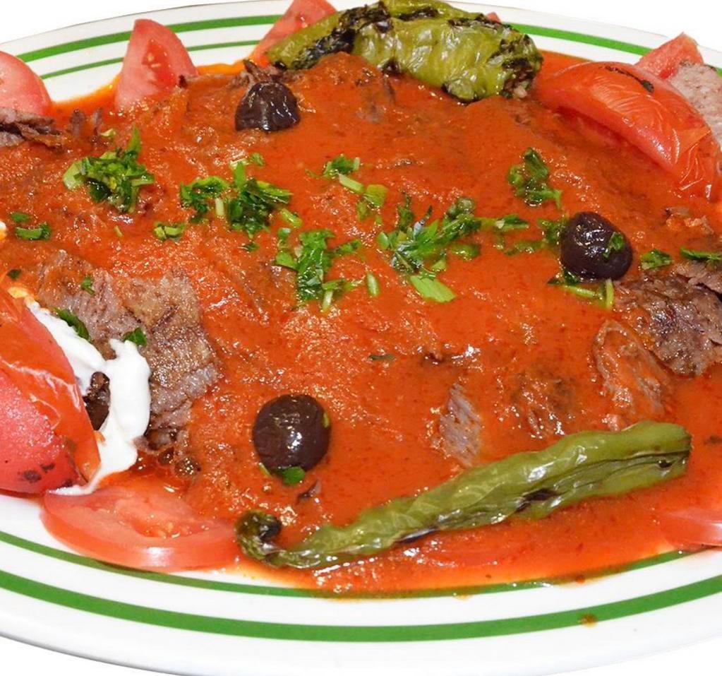Iskender Kebab with Lamb · Thinly sliced lamb doner kebab meat with homemade croutons and special tomato sauce.