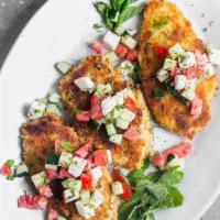 CHICKEN MILANESE  · Oversized chicken cutlet topped by mesclun salad Red onion cherry tomato and shaved Parmigia...
