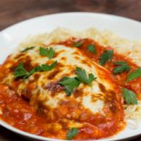 CHICKEN PARMIGIANA  · Oversized chicken cutlet in marinara and melted mozzarella sauce and
Spaghetti pasta  (No Pa...