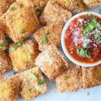 Miniature Fried Ravioli · Filled with ricotta and spinach with pesto, to share.