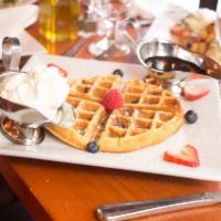 44SW Waffles Brunch · Fresh blueberry waffle, fresh fruit, warm maple syrup.