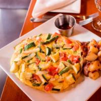 Skillet Frittata Brunch · Peppers, onions, sausage, bacon, cheddar cheese, side of roasted red rustic potatoes with pe...