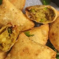 Whoa Samosa (veg) · Deep fried Indian Pie (Indian Empanada) filled with spiced potatoes and other vegetables. 2 ...