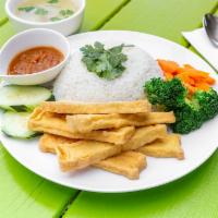 Khao Man TOFU (tofu & rice) · Khao Man (Rice), crispy tofu served with stream broccoli , carrot , cucumber , cilantro and ...