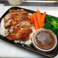 Khao Nah Phed (Duck &rice) · Roasted duck on rice served with duck sauce, steamed broccoli, carrot, and cilantro.