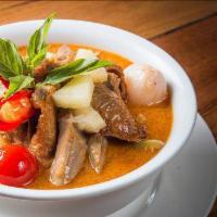 Duck Curry  · Red curry with roasted duck, pineapples, tomatoes, bell pepper, lychee, and basil.