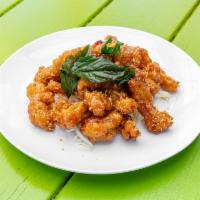 Crispy Basil Garlic Chicken  · Juicy on the inside and on the outside chicken tossed in sweet house special garlic sauce to...