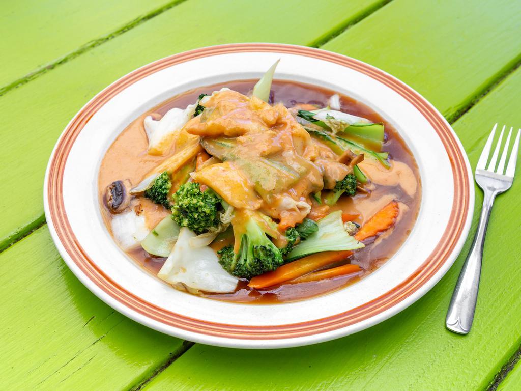 9. Pra-Ram · Stir-fried choice of meat carrot, cabbage, salary, chines cabbage, bok choy, broccoli, mushroom top with peanut sauce. Served with jasmine rice.