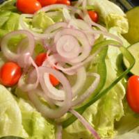Tossed Salad · Lettuce, tomatoes, onions, green peppers, black olives, cucumbers and hard-boiled egg.