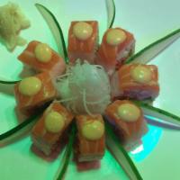 Pink Lady Roll · Spicy tuna, avocado shrimp wrapped with soy bean paper topped with salmon and spicy mayo.