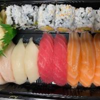 Sushi Deluxe · 9 pieces sushi, California or tuna roll. Served with miso soup or salad.