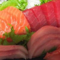 Triple Sashimi · 5 pieces tuna, 5 pieces yellowtail and 5 pieces salmon. Served with miso soup or salad.