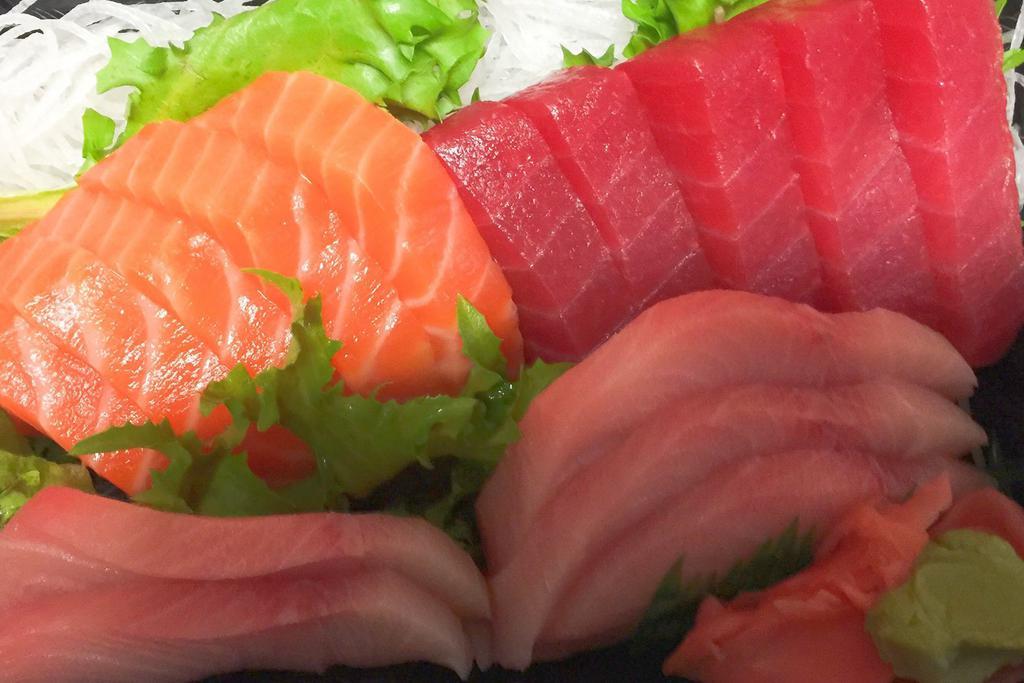 Triple Sashimi · 5 pieces tuna, 5 pieces yellowtail and 5 pieces salmon. Served with miso soup or salad.
