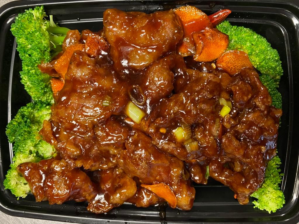 Orange Beef · Lightly battered and deep fried slices of tender beef tossed in a sweet and spicy aromatic orange sauce. Served with a side of your choice of rice. 