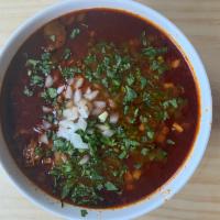 Birria de res,, birria soup · Spicy beef broth stew made tijua style with onions and cilantro. Served with tortillas.