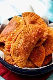 Empanadillas Criollas · Fried turnovers stuffed with cheese, spinach & raisins, beef, shrimp or chicken.