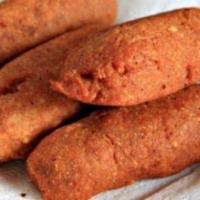 Alcapurrias · Fried green banana stuffed with beef.