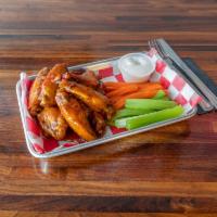 Wings · 8 pieces. Served with choice of sauce: mild, hot, BBQ, garlic, sweet chili teriyaki.