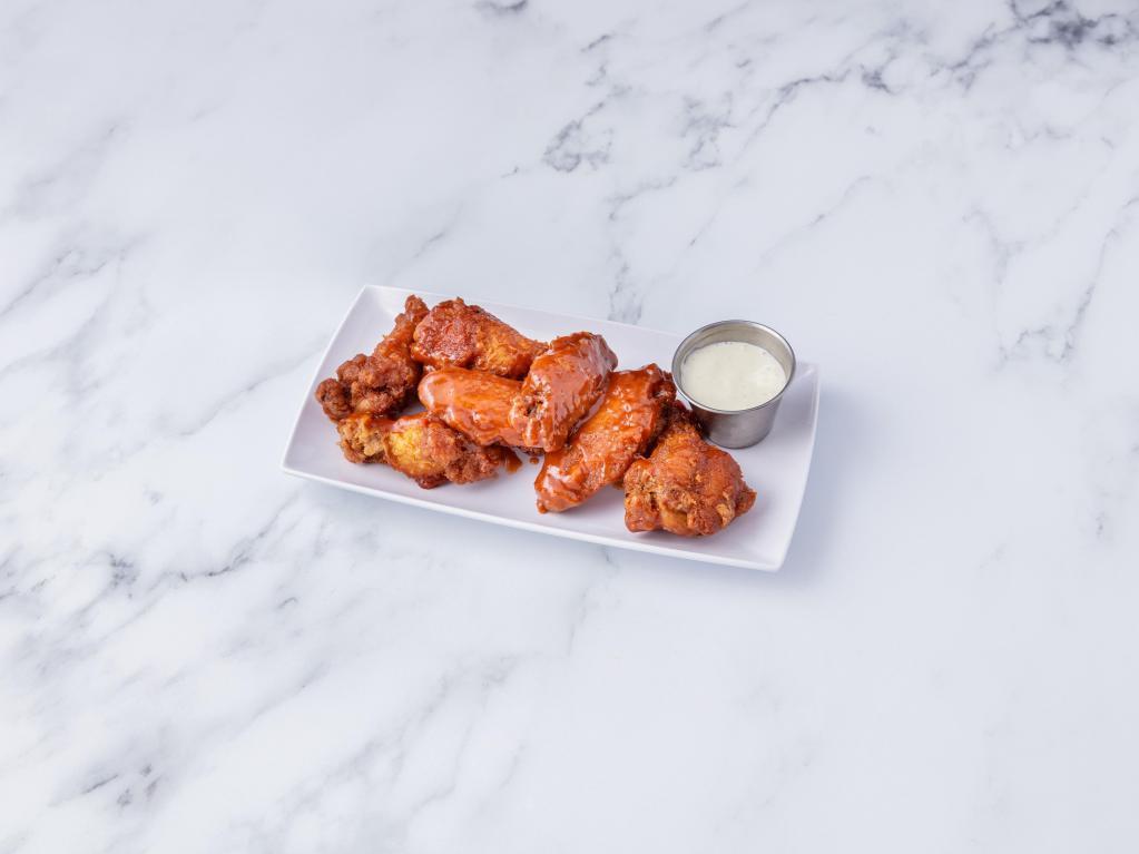 Buffalo Wings · Choose mild or hot. Served with blue cheese and celery.