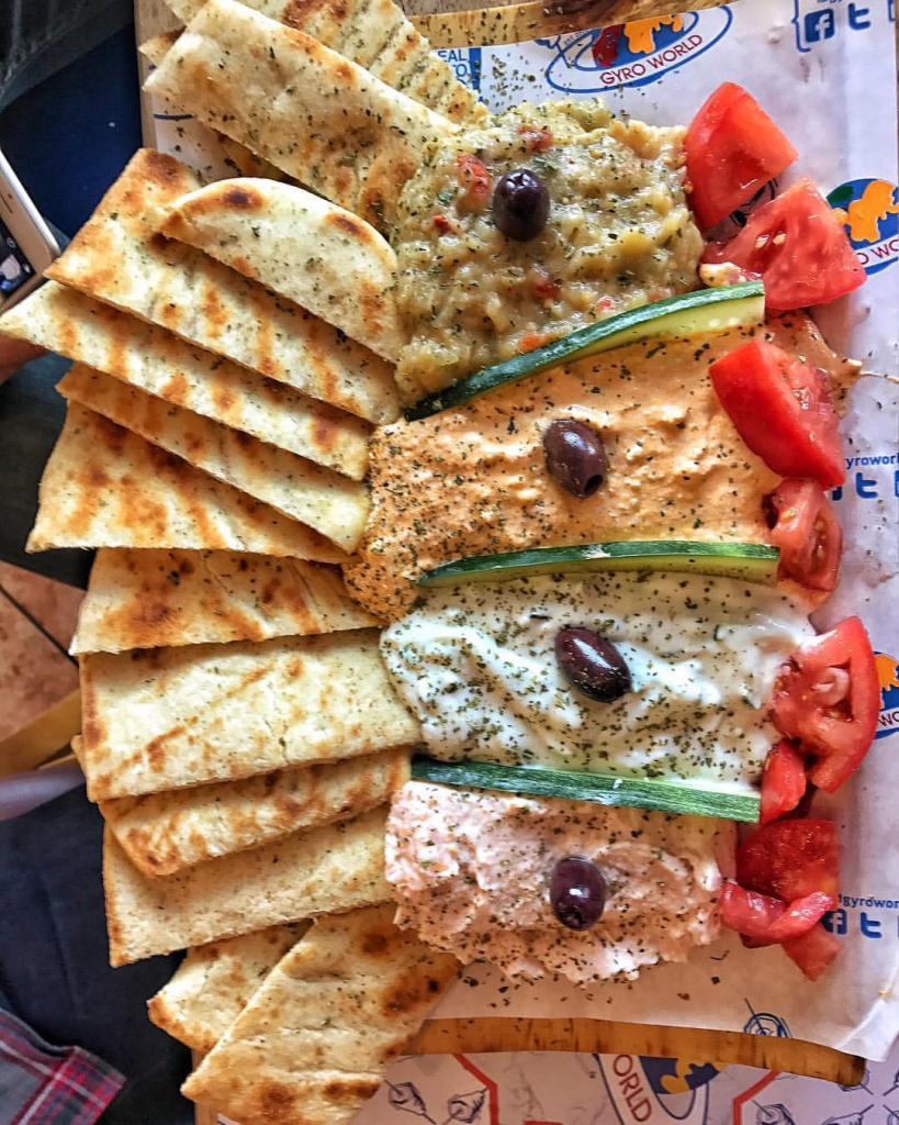 Dip & Spread Sampler · Sampler of all our signature spreads, served with 4 toasted pita breads.