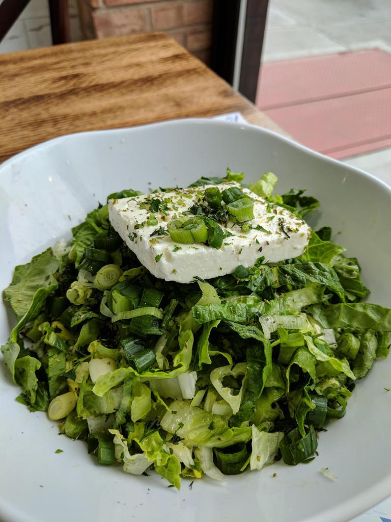 Green Salad · Lettuce, scallions, dill and imported Greek feta cheese. Served with our house dressing on the side.