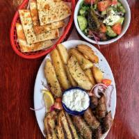 Combo of 2 Platter · Customize your own platter with a choice of two meats. Served with a starter, a side, toaste...