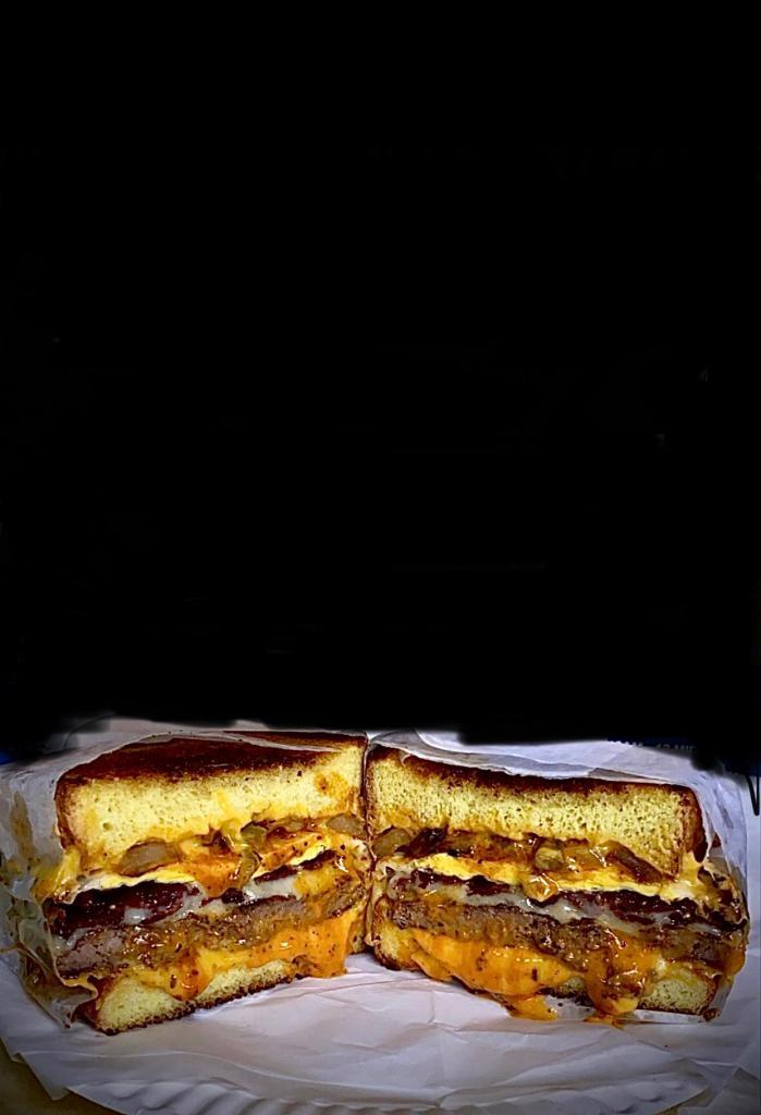 Breakfast burger  · Fried Egg , beef bacon , Swiss cheese ,grilled onions & peppers and tomatoe with chipotle mayo on Texas toast grilled cheese 