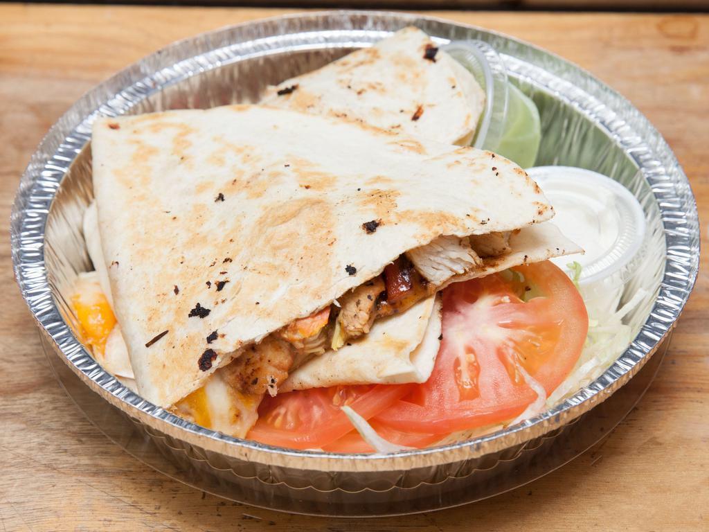 Q1. Chicken Quesadilla · Grilled chicken, chipotle Gouda, mozzarella, peppers, onions, sour cream and salsa. Served with side of salad, guacamole and sour cream.