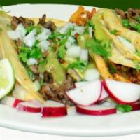 Tacos · Tacos per order. Your choice of Meat, onions, Cilantro & hot sauce