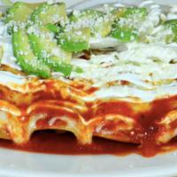 Enchiladas Suizas · Four enchiladas with your choice of filling, sauce and cheese. Served with rice and beans an...