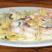 Fettuccine Alfredo · Served with bread and butter