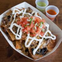 2. Meat Nachos · Cheese nachos with choice of meat.