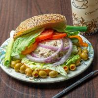 23. Albacore Tuna Sandwich · Homemade tuna salad, lettuce, tomato and mayo on a plain bagel.