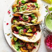 Vegetarian Taco (1pc) · sweet plantain, black bean, avocado, pickled onion, cojita cheese & cilantro