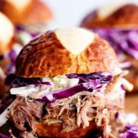 Kansas Pulled Pork Sandwich · BRAISED PULLED PORK, WHITE AMERICAN CHEESE, PICKLED CABBAGE, CARAMELIZED ONION, BELL PEPPER,...