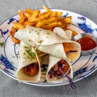 Fish Taco · Sliced cod, freshly breaded and fried served with sliced cabbage, onions, tomato, and dill s...