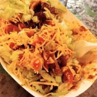 Walking Taco  · Chips, chili, cheese, lettuce, tomato, onion, and sour cream. Vegetarian option with refried...
