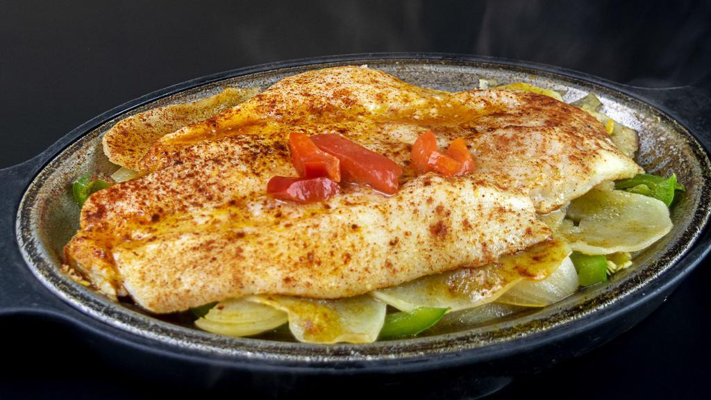 Filete de Pescado al Horno · Broiled Fish Filet. Served With Your Choice of 2 Sides.