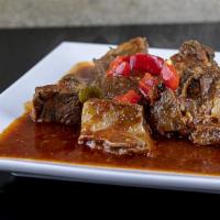 Chivo Guisado · Goat Stew. Served With your Choice of 2 Sides.
