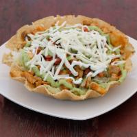 Grand Taco Salad · With crispy tortilla with beans, lettuce, tomatoes, cheese, guacamole and sour cream.