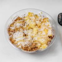 Coco Loco Bowl · Acai blended strawberries and bananas. Topped with pineapples, mango, coconut flakes, granol...