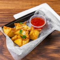 Crab Rangoons · Cheese filled wontons with real crab meat served with our Mamacita sweet sauce.