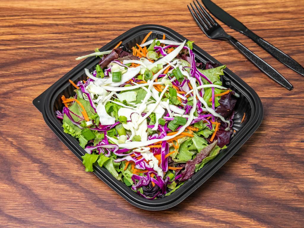 Slaw Salad · Mix greens, red and green cabbage, carrots, sesame sticks, green onions. Served with a balsamic red pepper dressing.