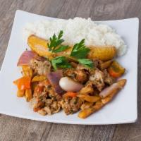 77. Lomo Salteado · Carne, pollo, cerdo. Sauteed pork, chicken or beef loin with tomato, onions, french fries an...