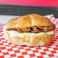Bacon egg cheese sandwiches croissants  · Served on a flaky French pastry with egg, bacon, and cheese.