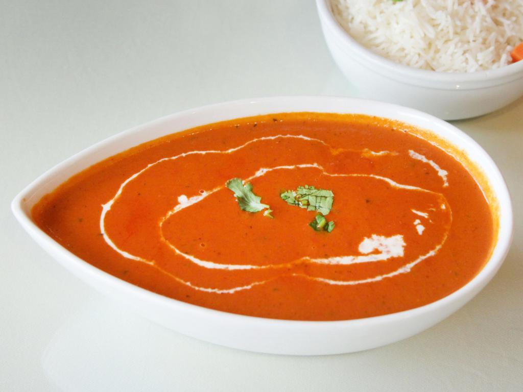 Chicken Tikka Masala · Skewered chicken cooked in a creamy tomato fenugreek sauce. Prepared with white meat and served with basmati rice.