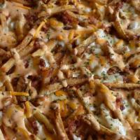 Bacon Potato Pizza · Using ranch dressing as our canvas, it’s loaded with crispy fries and stacked with bacon, mo...