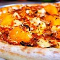 Tropicana Pizza · Marinara sauce, Canadian bacon, pineapple, mandarin oranges, sliced almonds and coconut.