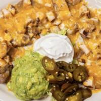 Small Chichen Fajita Nachos · Topped With Refried Beans And A Combination Of Melted Monterey And Cheddar Cheese, Served Wi...