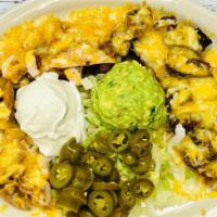 Small Mix Fajita Nachos · Topped With Refried Beans And A Combination Of Melted Monterey And Cheddar Cheese, Served Wi...